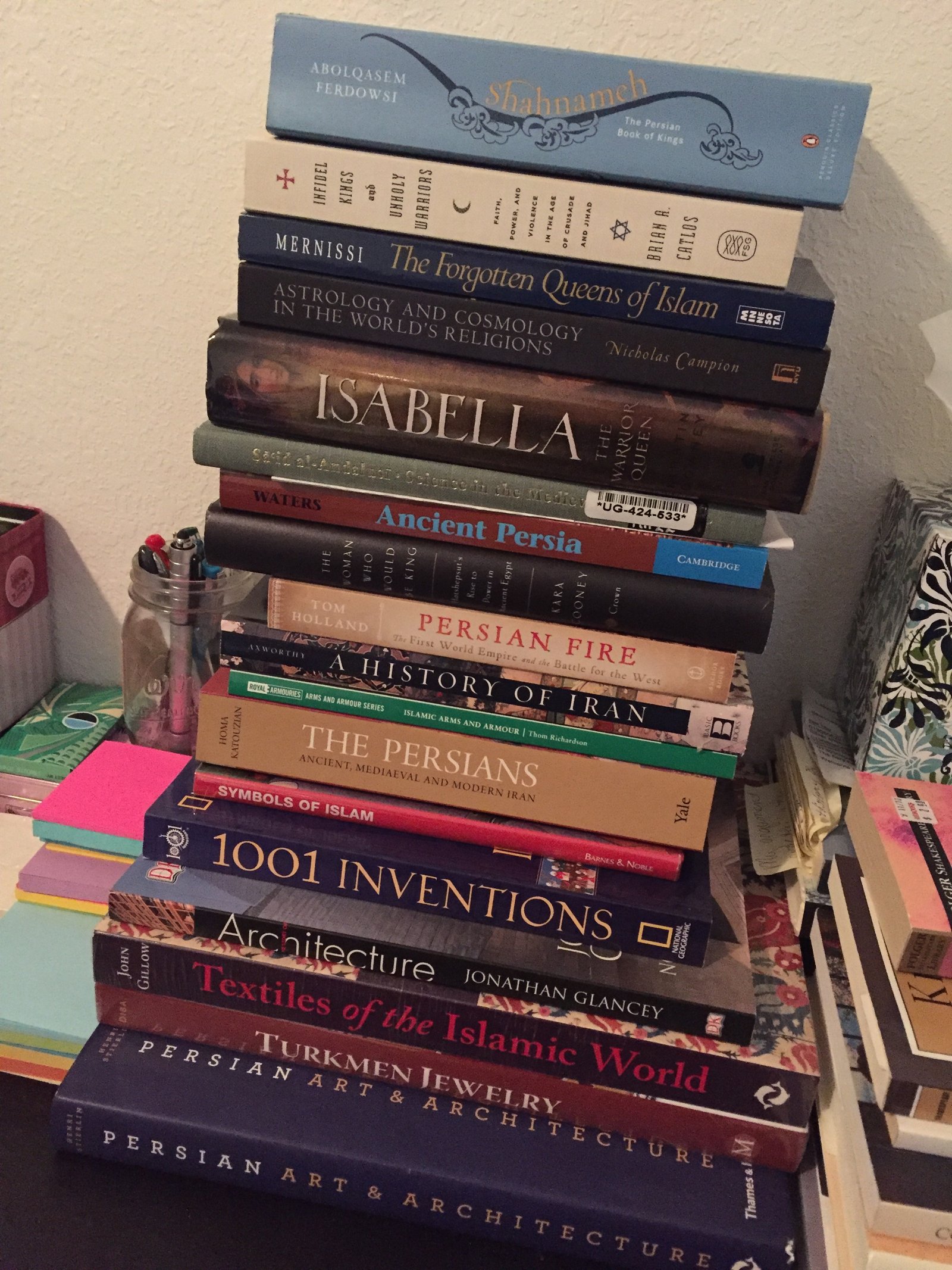 Stack of books, all non fiction titles. 